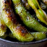 Pan Seared Edamame · A basket of pan seared edamame seasoned to perfection. Your choice of lightly seasoned or sw...