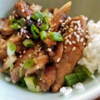 Chicken over Rice · Pan seared thinly sliced strips of seasoned chicken served over a bed of jasmine rice.  Garn...