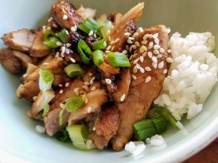 Chicken over Rice · Pan seared thinly sliced strips of seasoned chicken served over a bed of jasmine rice.  Garnished with green onions, sesame seeds, and savory teriyaki sauce.