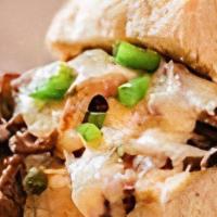 Cheese-Steak Slider · Two potato bread rolls overflowing with a quarter pound of real steak slices, sauteed green ...