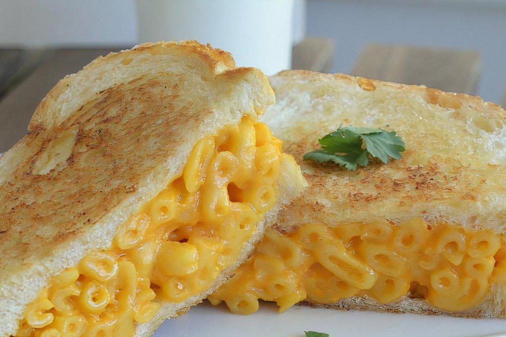 Mac N’ Cheese Grilled Cheese · A hearty cheddar cheese grilled cheese sandwich stuffed with our in-house country style Mac N’ Cheese.  Delicious!