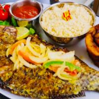 Cassava and tilapia fish + plantains  · Grill fish onions tomato peper sauce fry plantains and cassava 