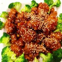 S4. Sesame Chicken · Marinated chicken chunks fried and sauteed in tangy brown sauce. Sprinkled with sesame seeds...