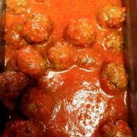 Polpette · Beef meatball braised in tomato sauce.