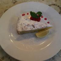 TORTA DELLA NONNA · Pastry cream with a hint of lemon on a base os shortcrust pastry, covered with pine nut,
alm...
