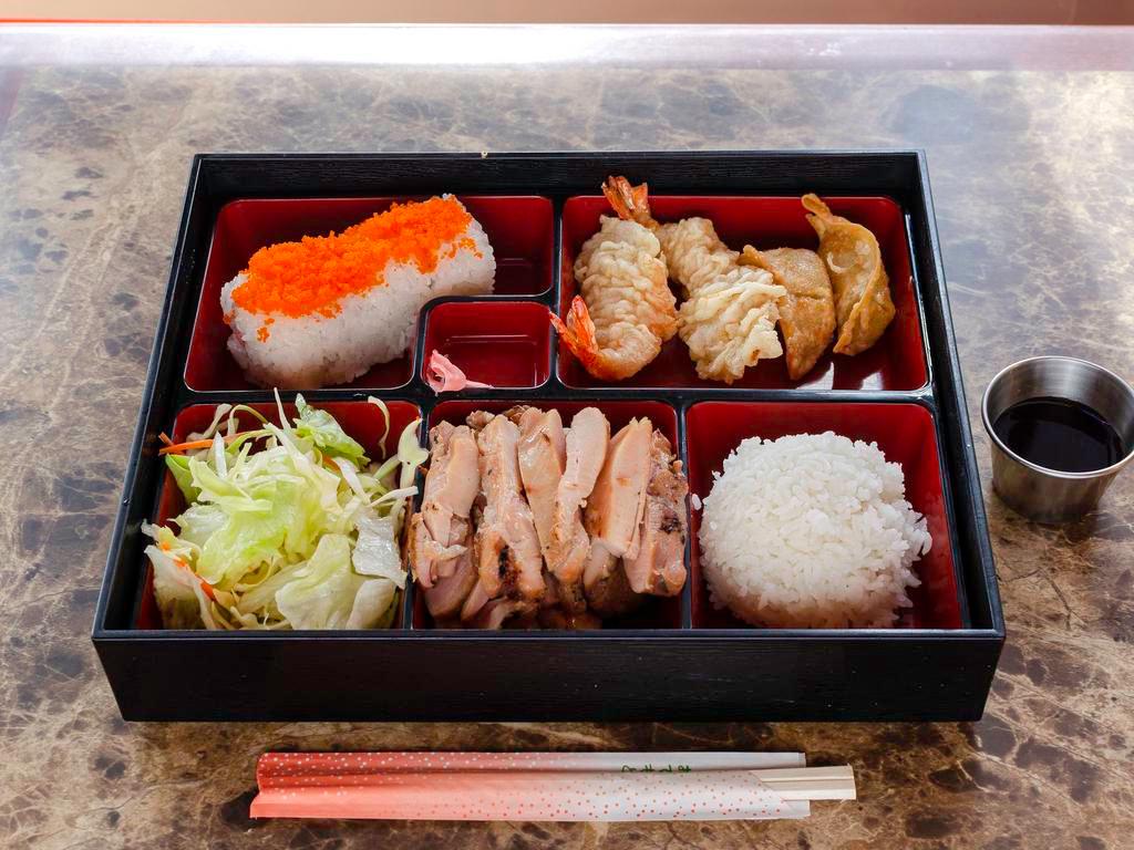 Bento B · Chicken katsu, shrimp tempura (2 pieces), gyoza (3 pieces), California roll (4 pieces), steamed rice and salad.