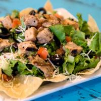 Taco Salad · Start with a bed of green leaf lettuce, add your choice of meat or veggie option, favorite f...
