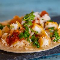 Baja Fish Tacos · Lightly battered white fish, made 