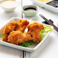 Chicken Wings · Cooked wing of a chicken coated in sauce or seasoning.