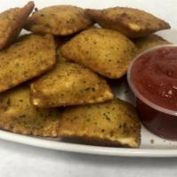 Breaded Ravioli · Deep fried breaded cheese ravioli served with a side of dipping sauce.