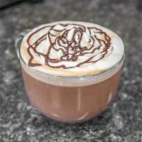 Mocha · Espresso, Ghirardelli  white or dark chocolate sauce, milk and whip.