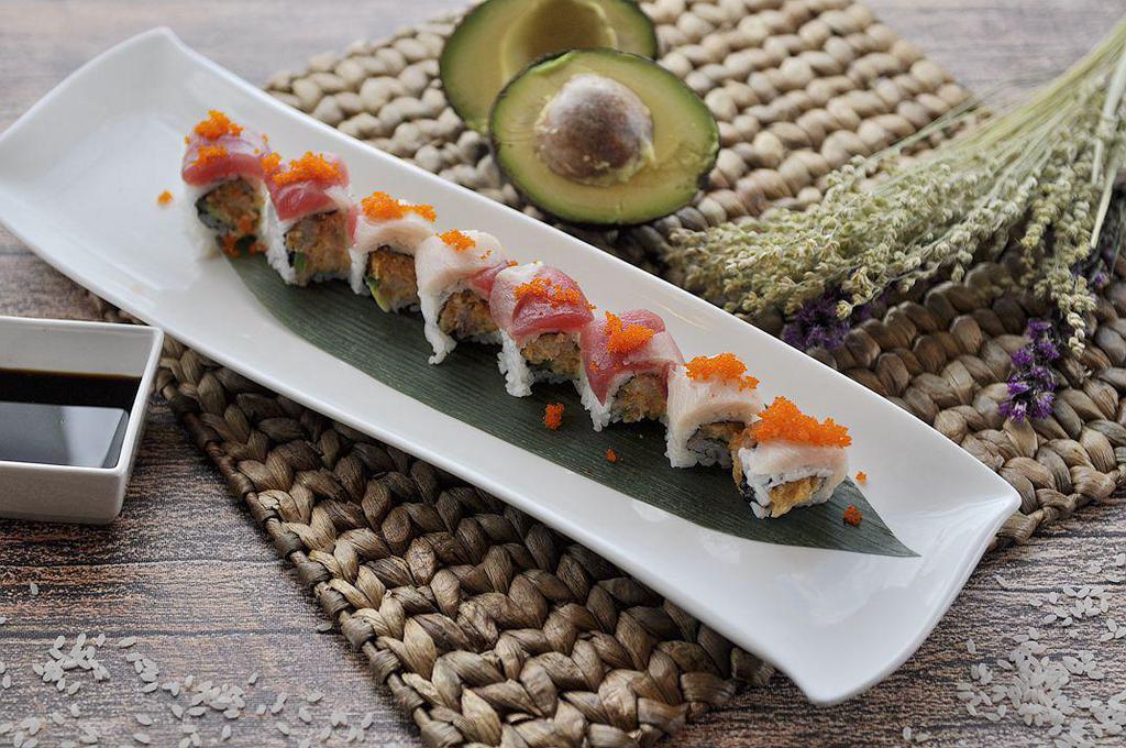 Red Hamachi Roll · Spicy yellowtail, jalapeno, crunchy inside, fresh tuna, yellowtail and tobiko on top.