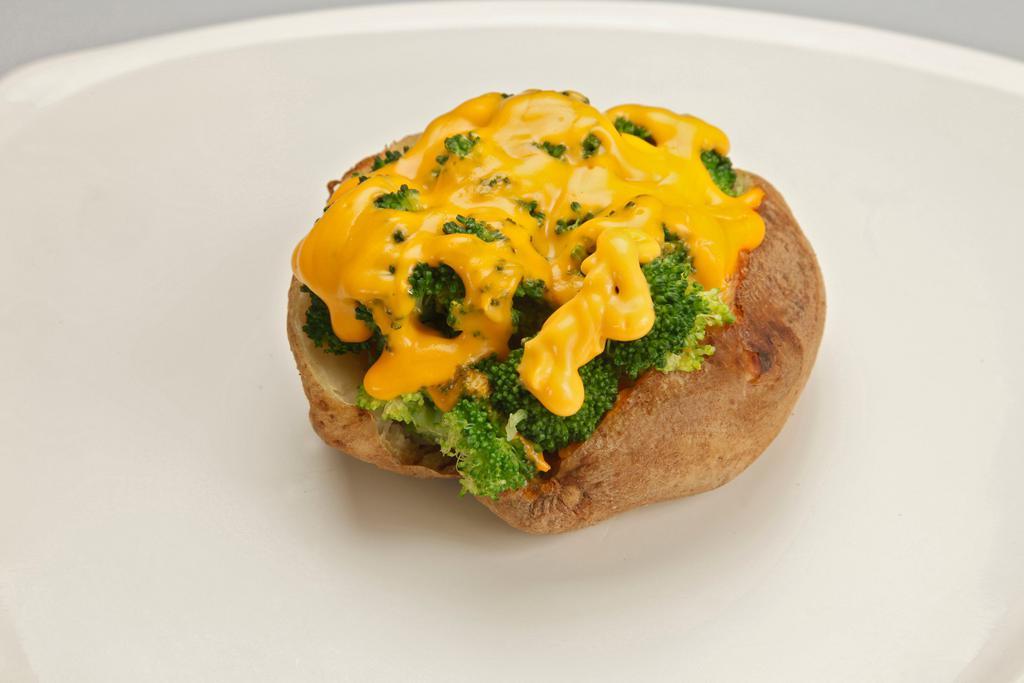 Lean and Loaded Baked Potato · Baked potato topped with low fat cheddar, scallions, fat free sour cream and lean turkey bacon.