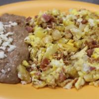 Huevos al Gusto · Eggs with the meat of your choice: ham, chorizo, bacon, sausage, mexican style or potatoes.