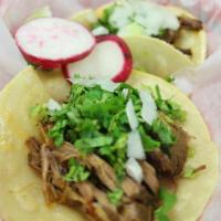 Taco · Corn tortilla with choice of meat, onions and cilantro.