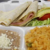 Quesadilla Plate · Flour quesadilla with choice of meat, served with rice, beans and small salad.