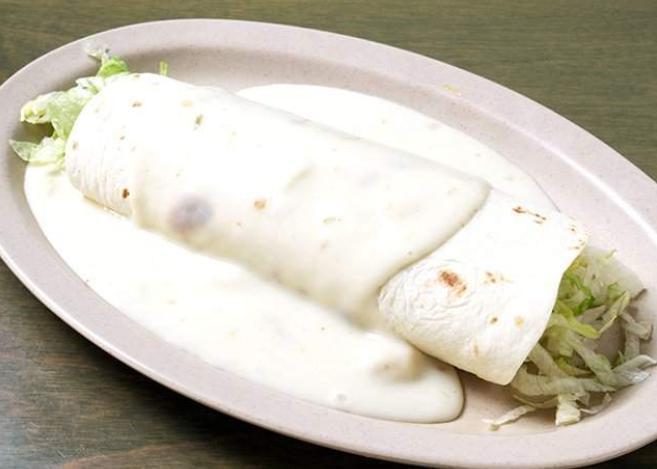 Queso Burrito · Your choice of an original burrito covered with our spicy white queso sauce