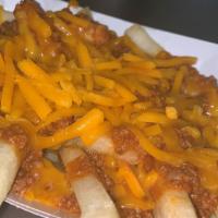 Coney Fries · Fries covered with Dads Coney sauce and cheddar cheese topped with diced onions