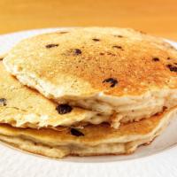 Chocolate Chip Pancakes · Pancakes stuffed with chocolate chips. Served with butter and syrup.
