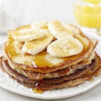 Banana Pancakes · Pancakes w/sliced banana topped with walnuts and whip cream
