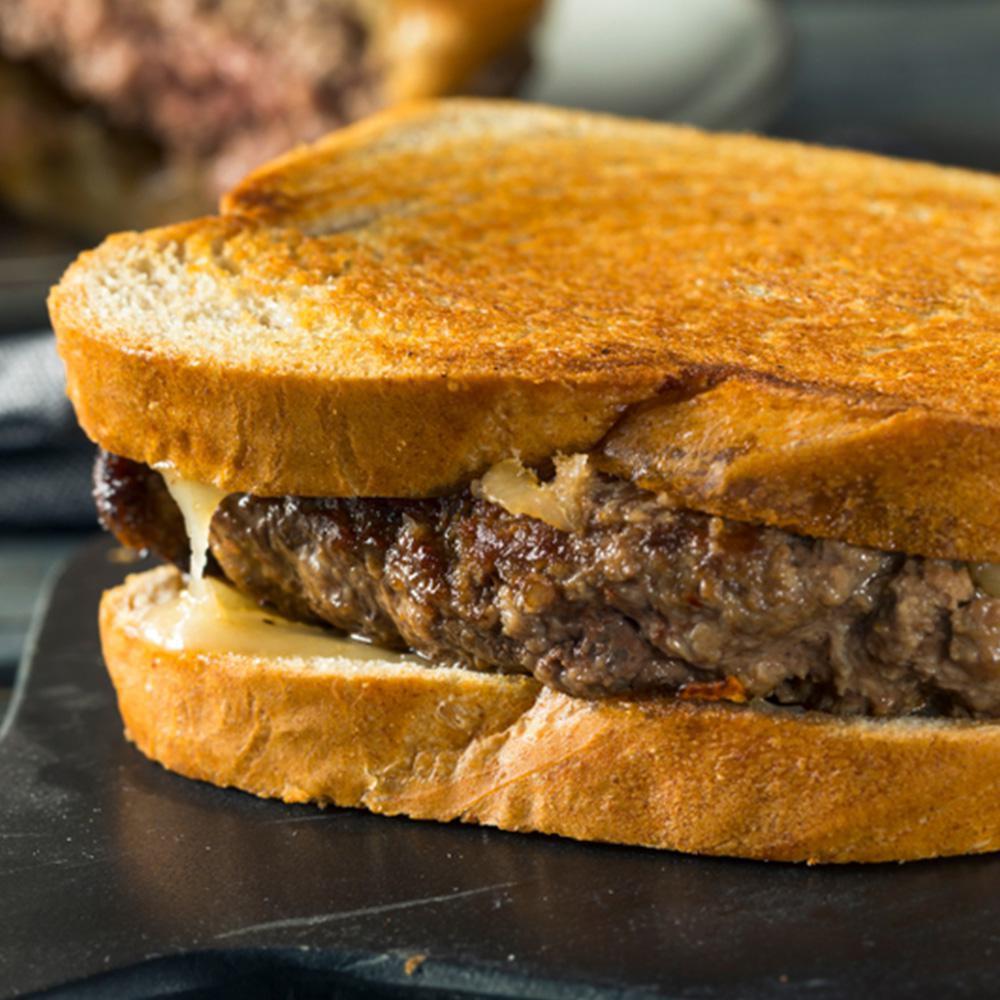 Grubbs Patty Melt · Melted Cheddar Cheese with caramelized onions on our 5 oz. homemade 100% beef burgers.
