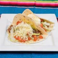 Tacos Mex-Am · 3 flour tortilla tacos filled with steak melted chihuahua cheese, sliced avocado and pico de...