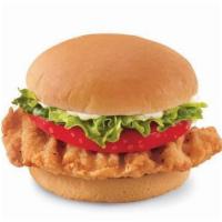 Crispy Chicken Sandwich · A crispy chicken fillet topped with crisp chopped lettuce, thick-cut tomato and mayo on a wa...