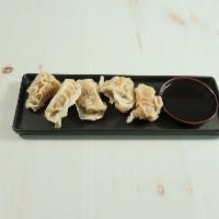 Dumplings · Homemade dumplings with ginger scallions dipping sauce. 5 pieces.