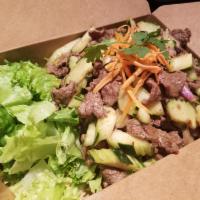 Yum Neau Salad · Sliced beef, cucumber and onions over greens lettuce with roasted chili lime dressing.