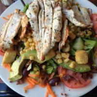 Cobb Salad · With grilled chicken breast, avocado, bacon, corn, tomatoes, cucumbers and red onions served...