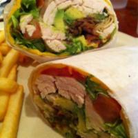 Turkey BLT Wrap · Sliced turkey breast with bacon, lettuce, tomatoes and melted cheese. Served on a flour tort...