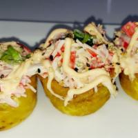 Tostones rellenos · Fried plantain filled with our spicy crab salad ,avocado & cream cheese ,scallions and sesam...