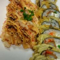Twister shrimp · Shrimp tempura roll with baked  spicy mix seafood on top 