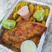 Pechuga con tostones /grilled chicken with fried green plantain · Served with tostones.