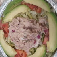 Avocado tuna salad · Lettuce, tuna salad, avocado, onions, cucumber and tomatoes.