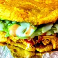 Patacon Plantain Sandwich (Chicken and Pork) · Fried plantain filled with chicken and pork, cheese, lettuce, tomatoes and special house sau...