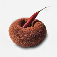 Ring of Fire · Chocolate cake doughnut dusted in cinnamon sugar, cayenne pepper and topped with a dried red...