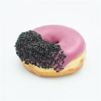Viscous Hibiscus · Raised yeast doughnut dipped in hibiscus flavored frosting and black sprinkles.