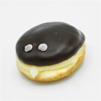 Vegan Portland Cream · Vegan raised yeast shell filled with Bavarian cream and topped with chocolate and two eyebal...
