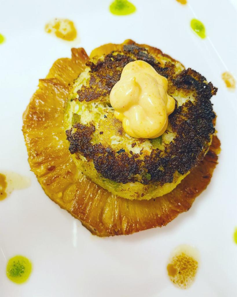 Crab Cake · Jumbo lump crab meat patty served over caramelized pineapple ring, chipotle, aioli, and balsamic glaze.