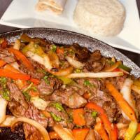 Fajitas Entree · Sauteed with onions and peppers, served with rice, refried bean, and grilled corn tortillas.