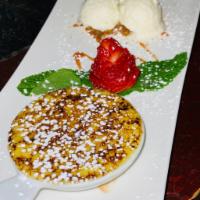 Creme Brulee De Guayaba · Served with guava jam and vanilla ice cream.