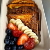 French Toast · Four pieces of french toast served with berries, banana and syrup 