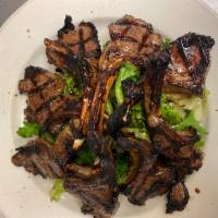 Lamb Chops · Grilled and marinated with balsamic vinegar and seasoning over a bed of spring mix or sautee...