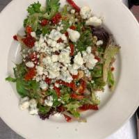 nsalata alla Gorgonzola · Spring mix served with Gorgonzola cheese, sun-dried tomatoes and walnuts in a balsamic vinai...