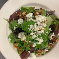 Pear Salad · Spring mix, poached pears, caramelized walnuts, sunflower seeds, Gorgonzola cheese, raspberr...