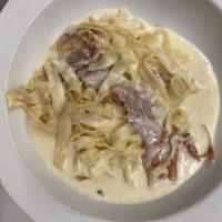 Fettuccine Alfredo Pasta · Homemade fettuccine with cream sauce and Parmesan cheese, with or without prosciutto.
