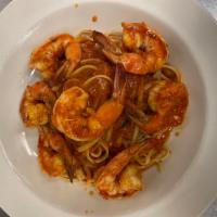 Shrimp Scampi  · Jumbo shrimp over linguine served in the following sauces: rose, cognac cream or oil and gar...