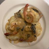 Vitello Mare e Monti  · Veal medallions with jumbo shrimp, mozzarella cheese, and prosciutto in a mushroom demiglass...