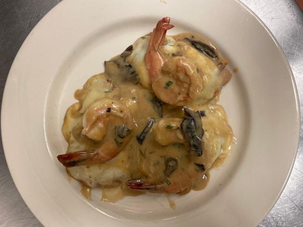 Vitello Mare e Monti  · Veal medallions with jumbo shrimp, mozzarella cheese, and prosciutto in a mushroom demiglasse sauce.